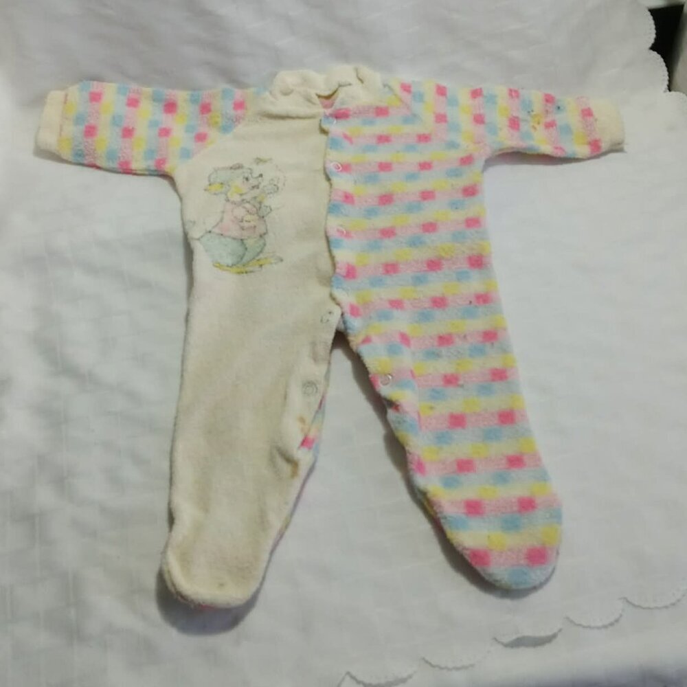 Vintage baby sleeper with a pastel checkered pattern and a character design 1977